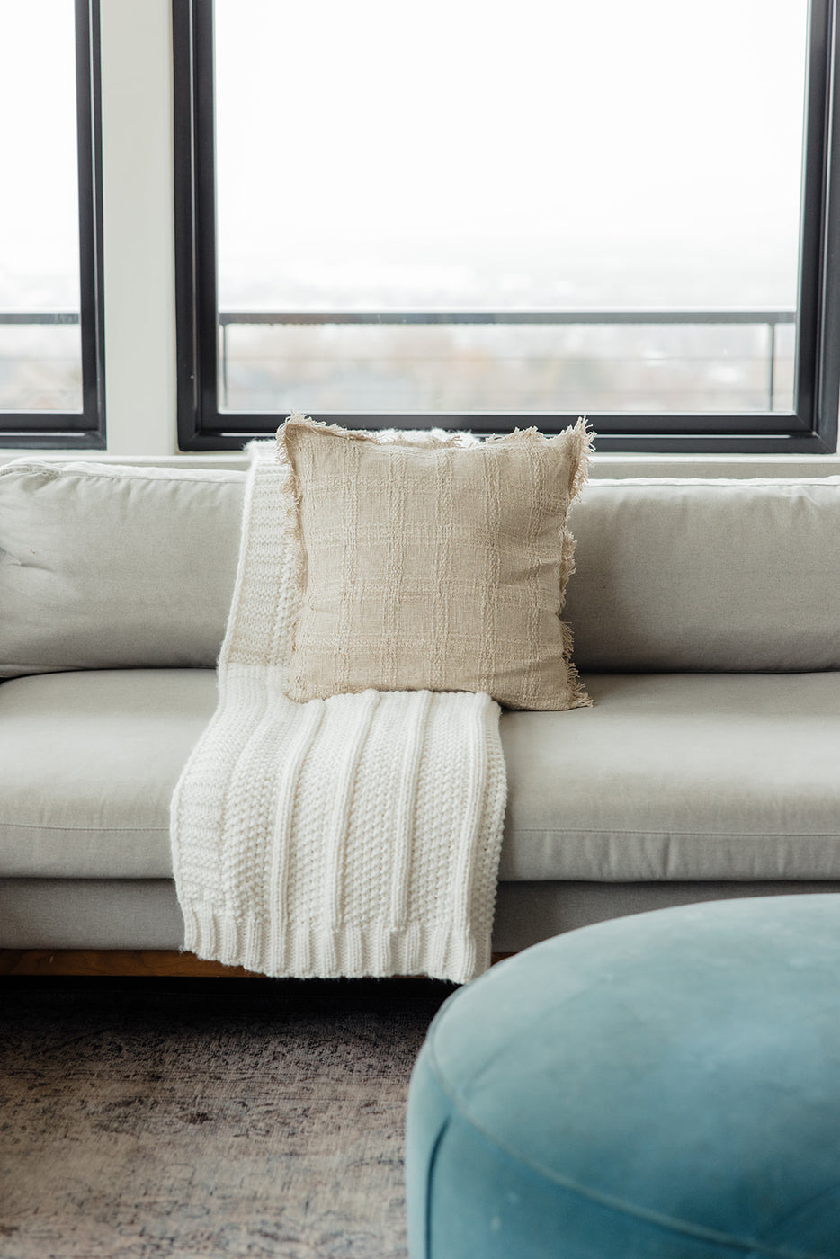 a white blanket on a couch