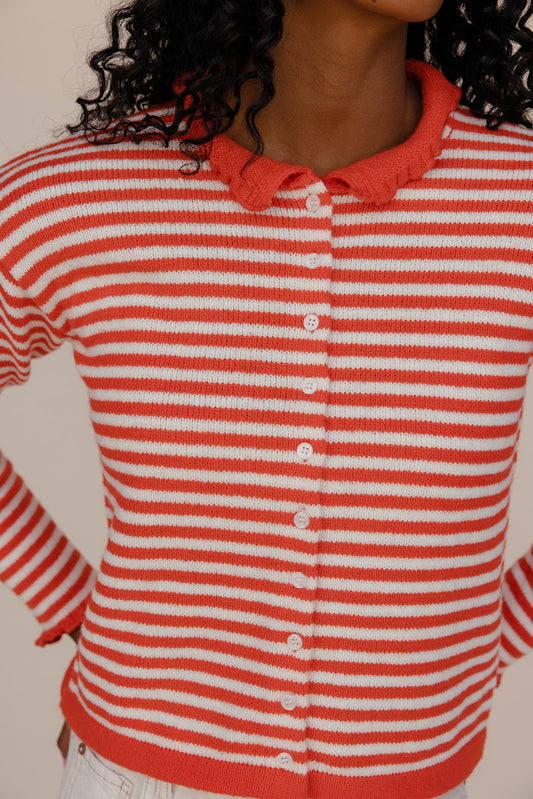 Red and white striped cardigan worn by a person