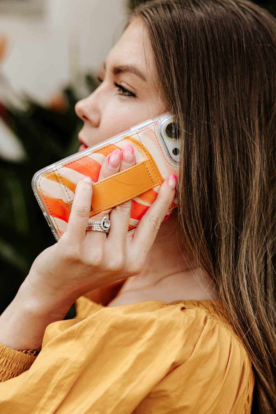 a woman holding a phone to her ear