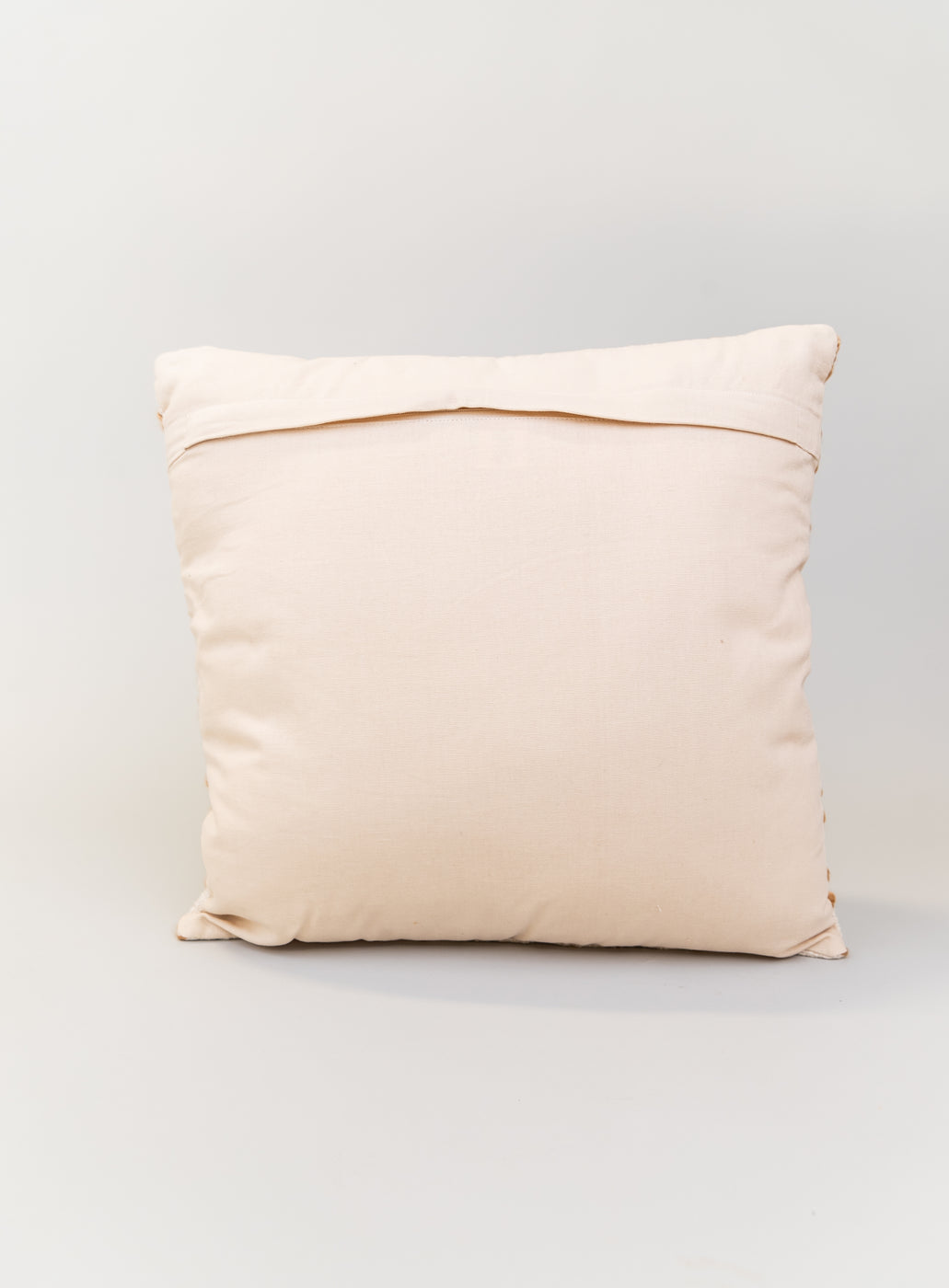 a white pillow with a brown edge