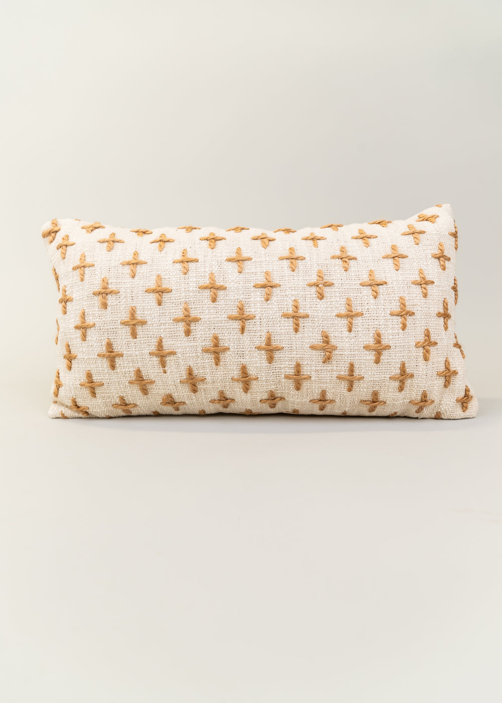 a white and brown pillow