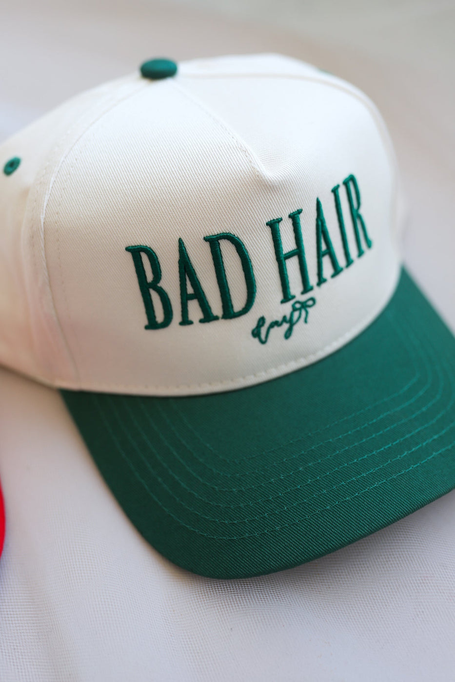 a white and green hat with text on it