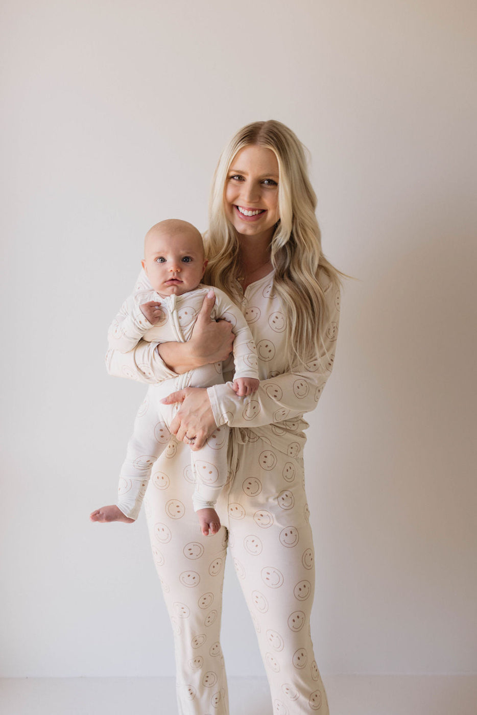 a woman holding a baby