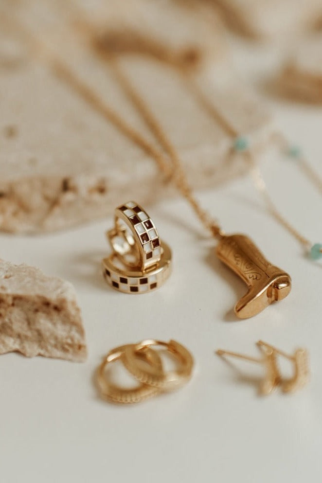 a group of gold jewelry