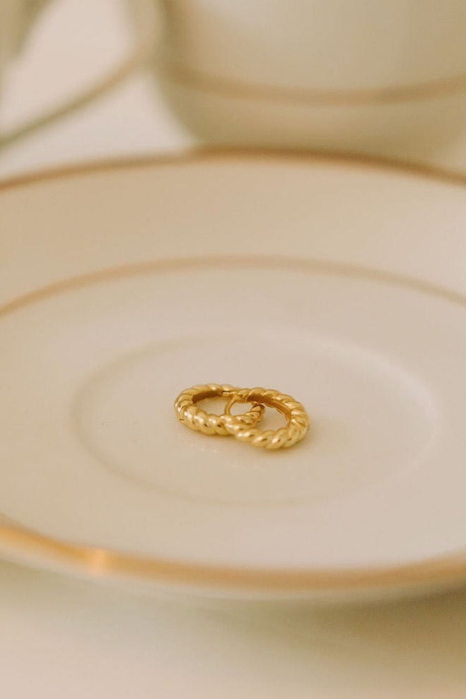a gold ring on a plate