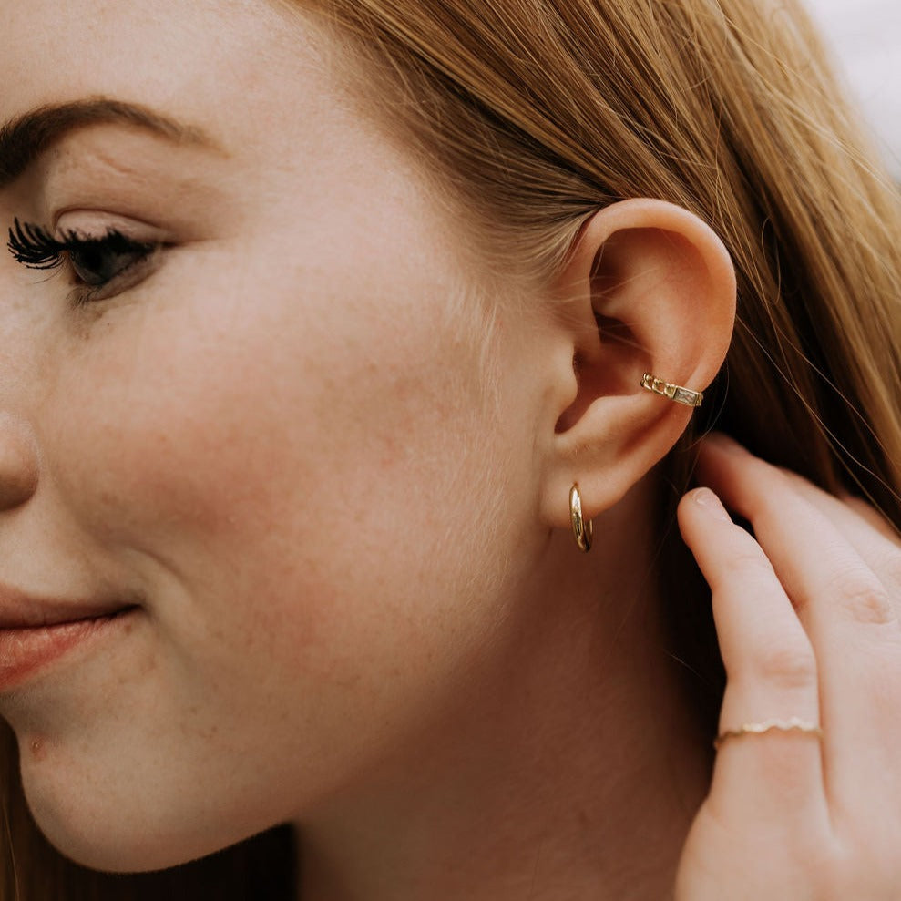 a woman with earring and earring