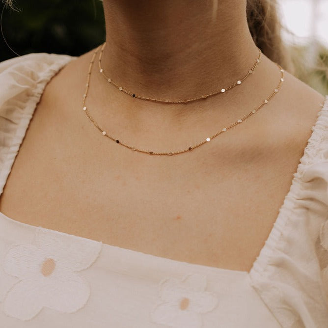 a woman wearing a necklace