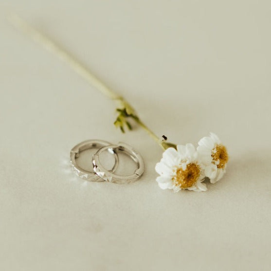 a pair of rings and a flower