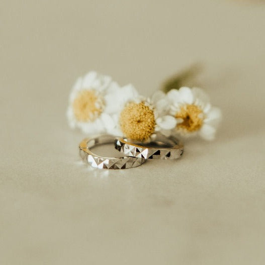 a pair of rings with flowers