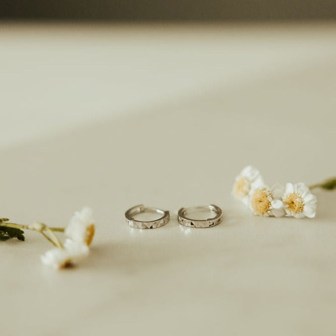 a pair of rings and flowers