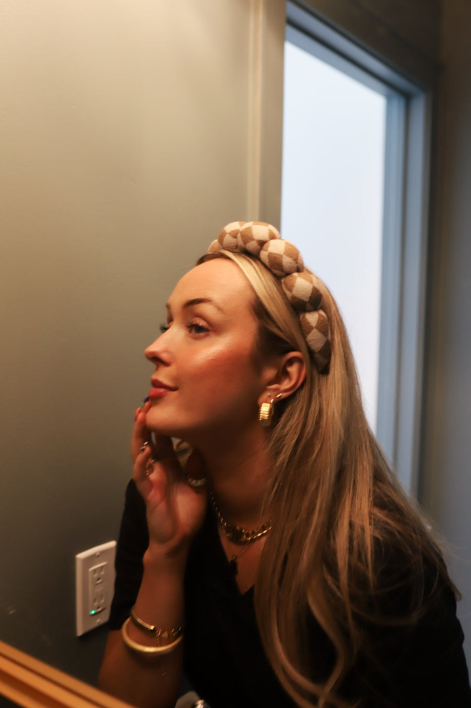 a woman with a headband in her hair