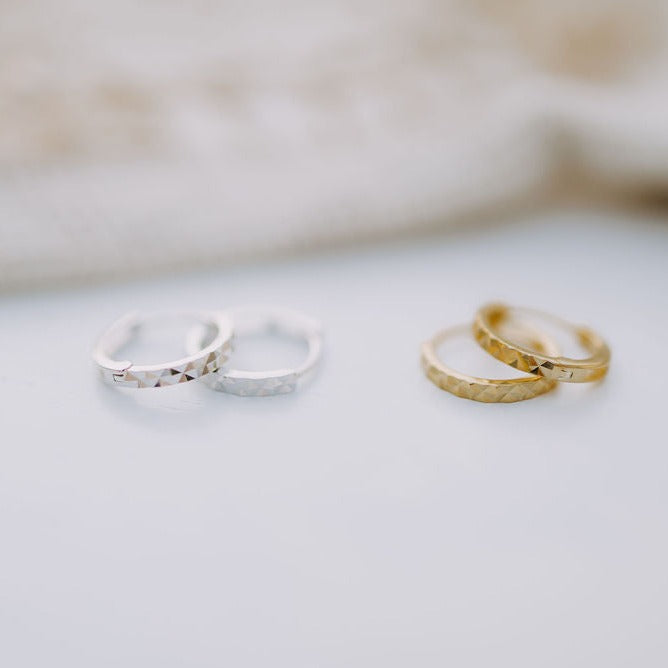 a pair of rings on a white surface