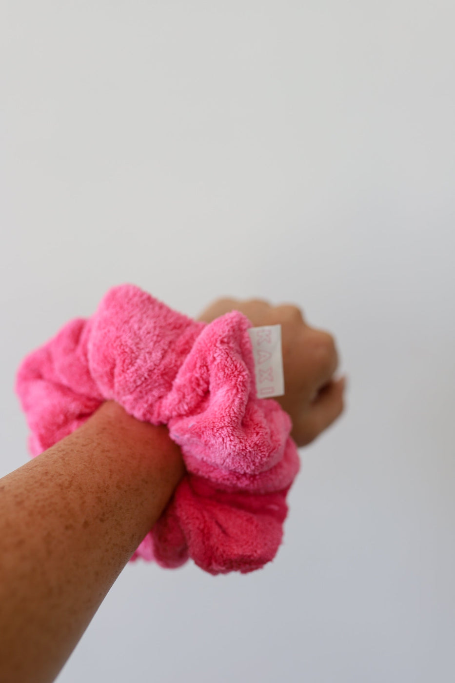 a pink towel on a wrist