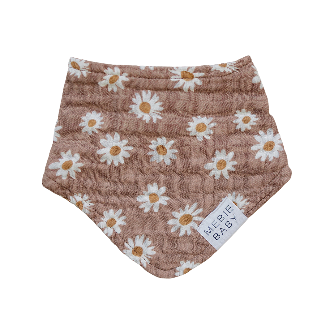 a brown bandana with white flowers on it