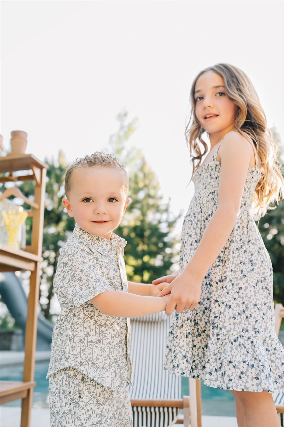 a boy and girl holding hands