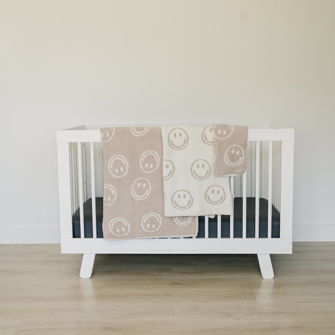 a crib with a blanket and a blanket on it