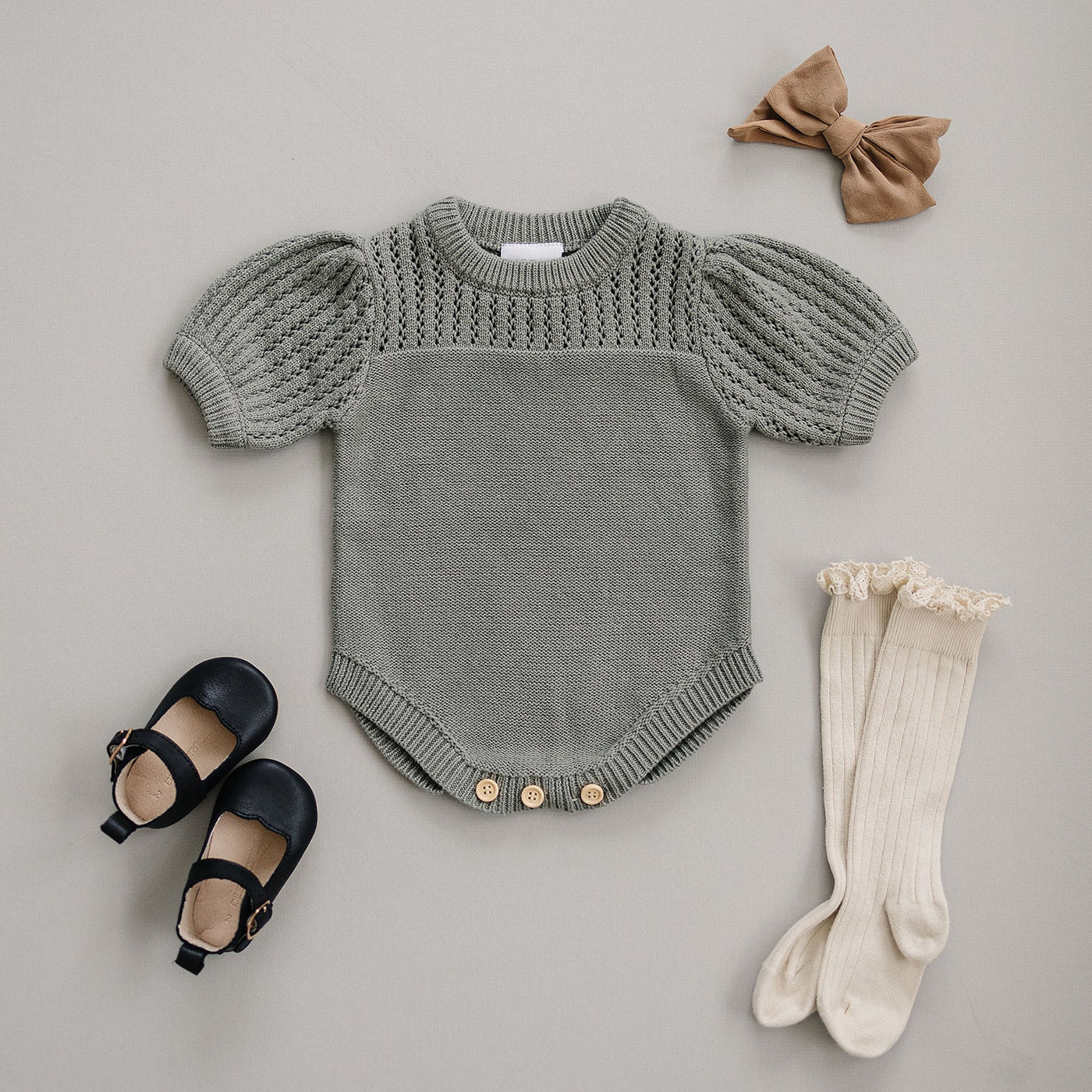 a baby clothes and shoes