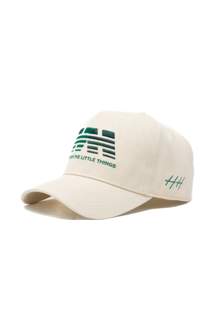 a white hat with green text