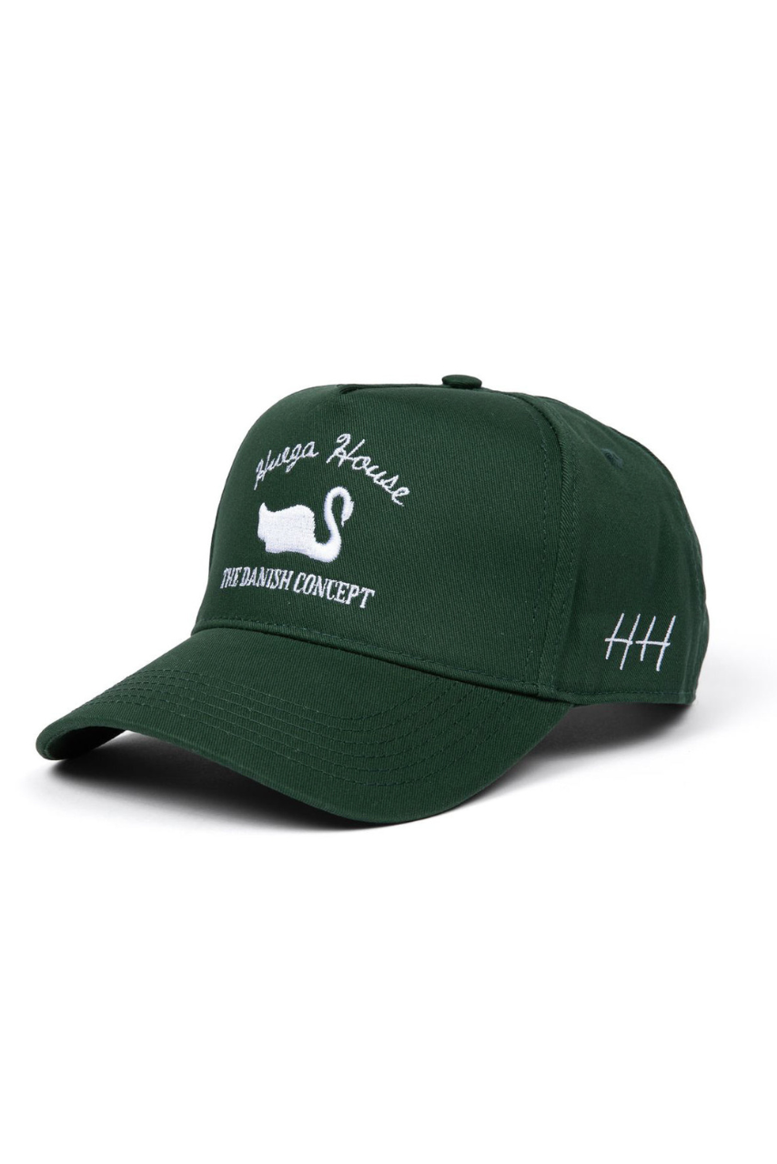 a green hat with white text and swan on it