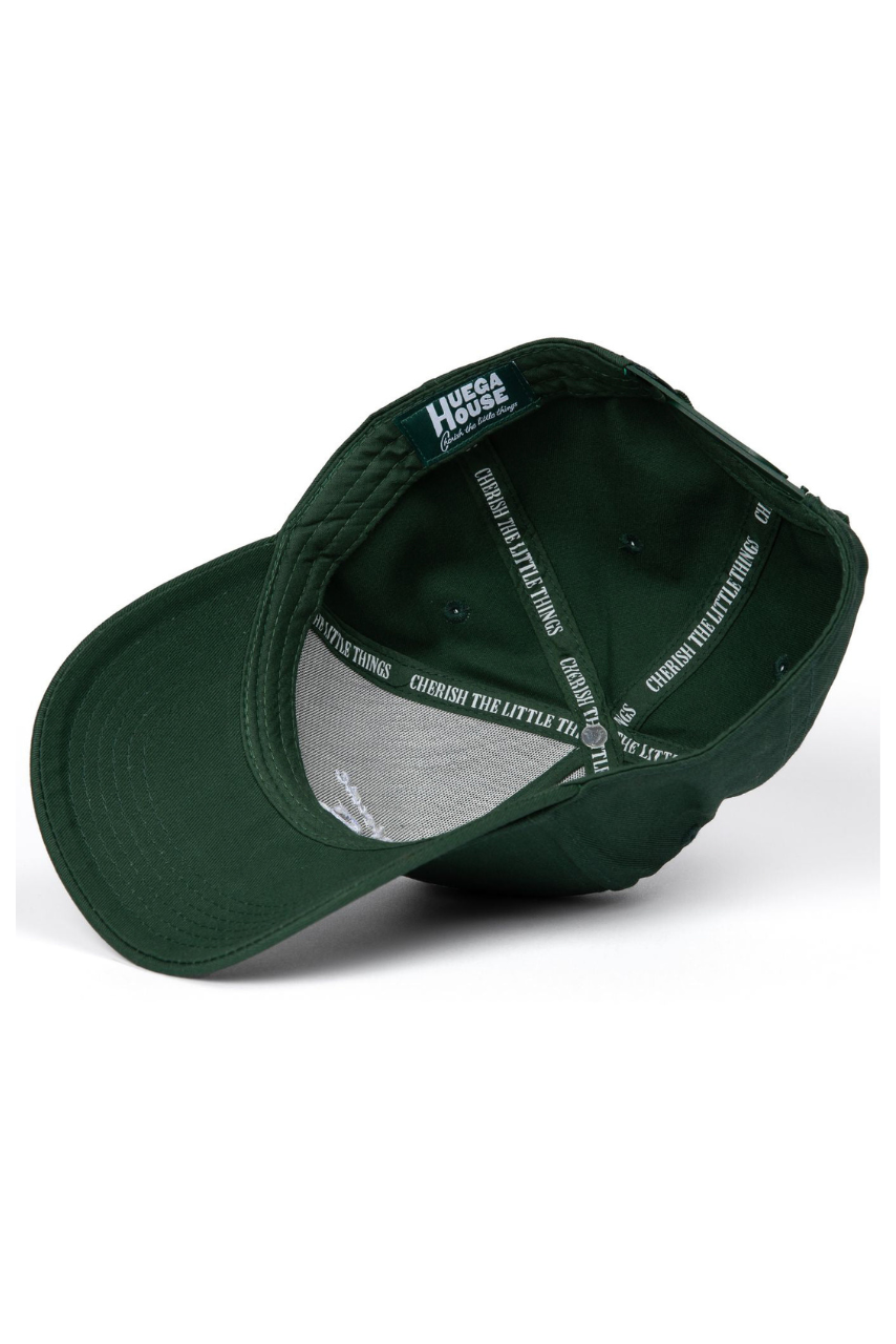 a green hat with white text on it