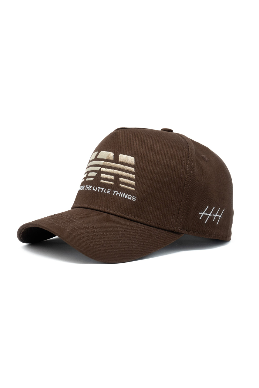 a brown hat with white text