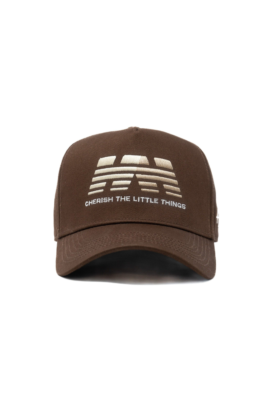 a brown hat with white text