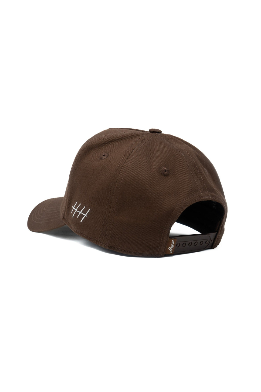 a brown hat with white numbers on it