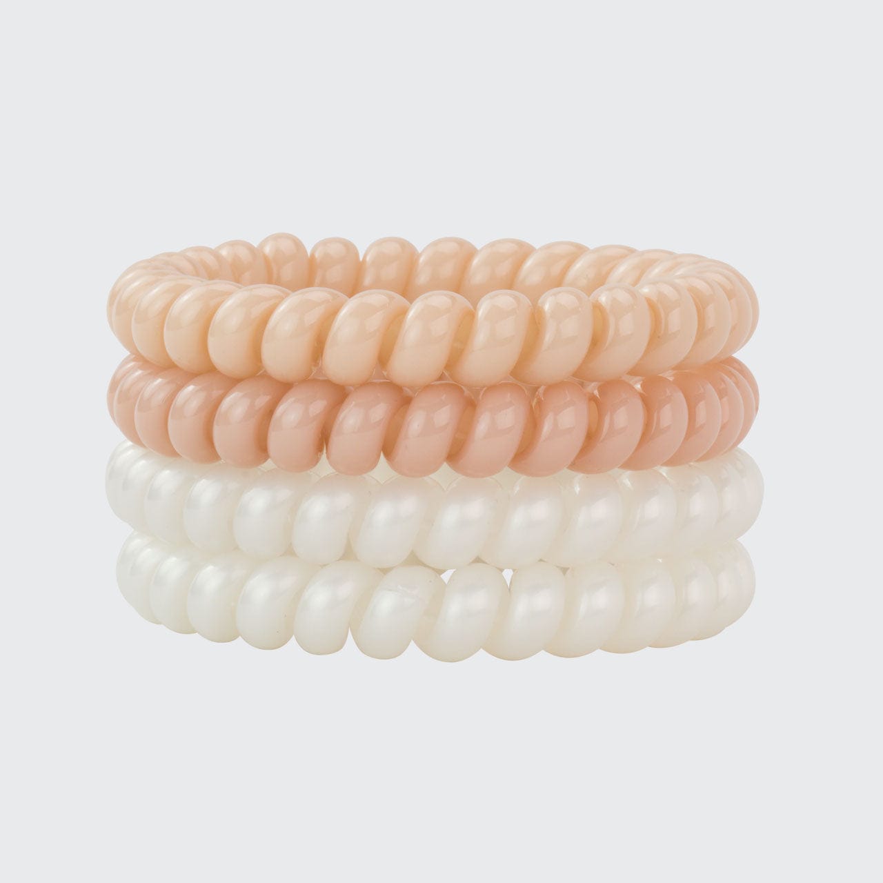 a stack of spiral shaped bracelets