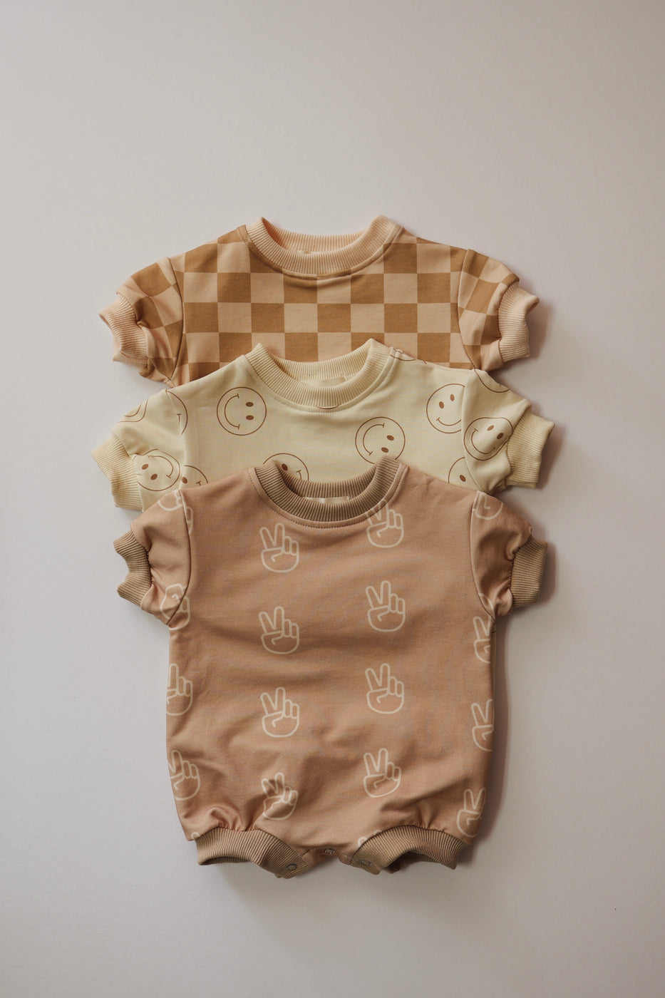 a group of baby clothes