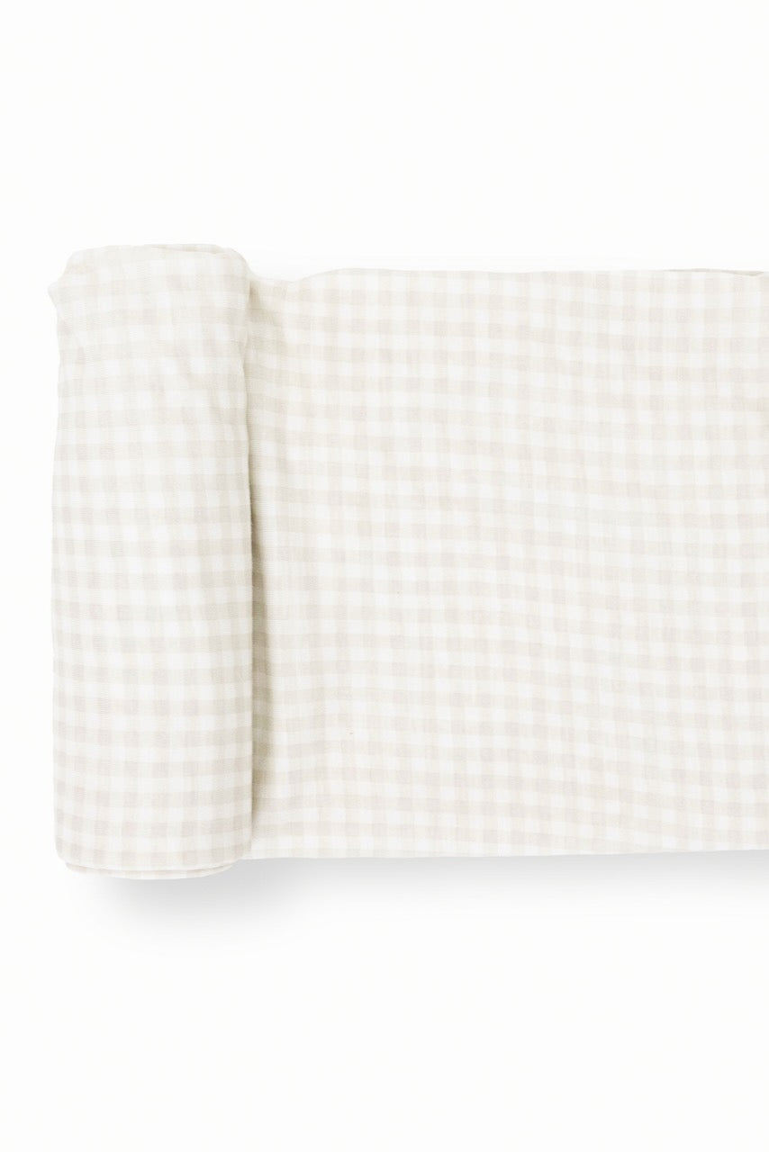 a white and grey checkered fabric rolled up