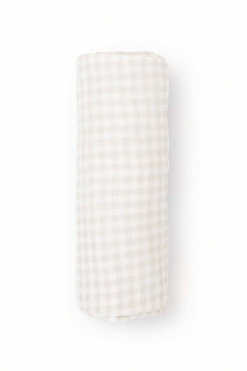 a white and brown plaid blanket