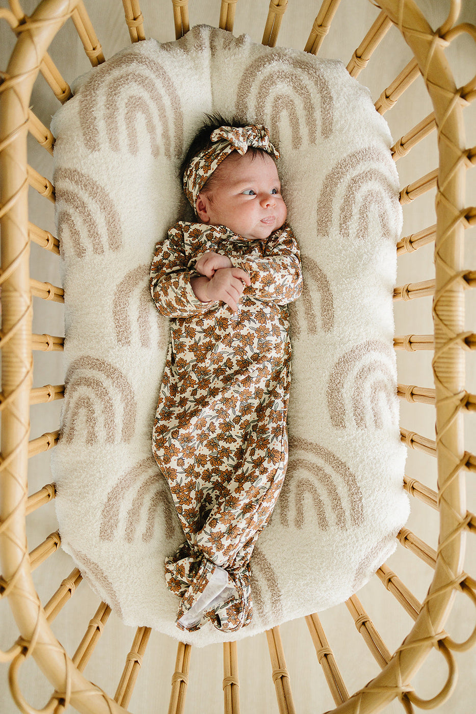 a baby lying in a crib
