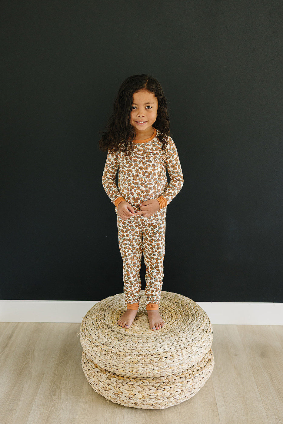a girl standing on a round object