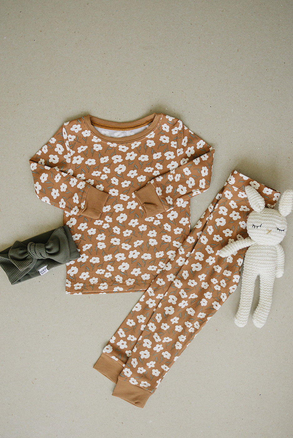 a baby clothes and a stuffed animal