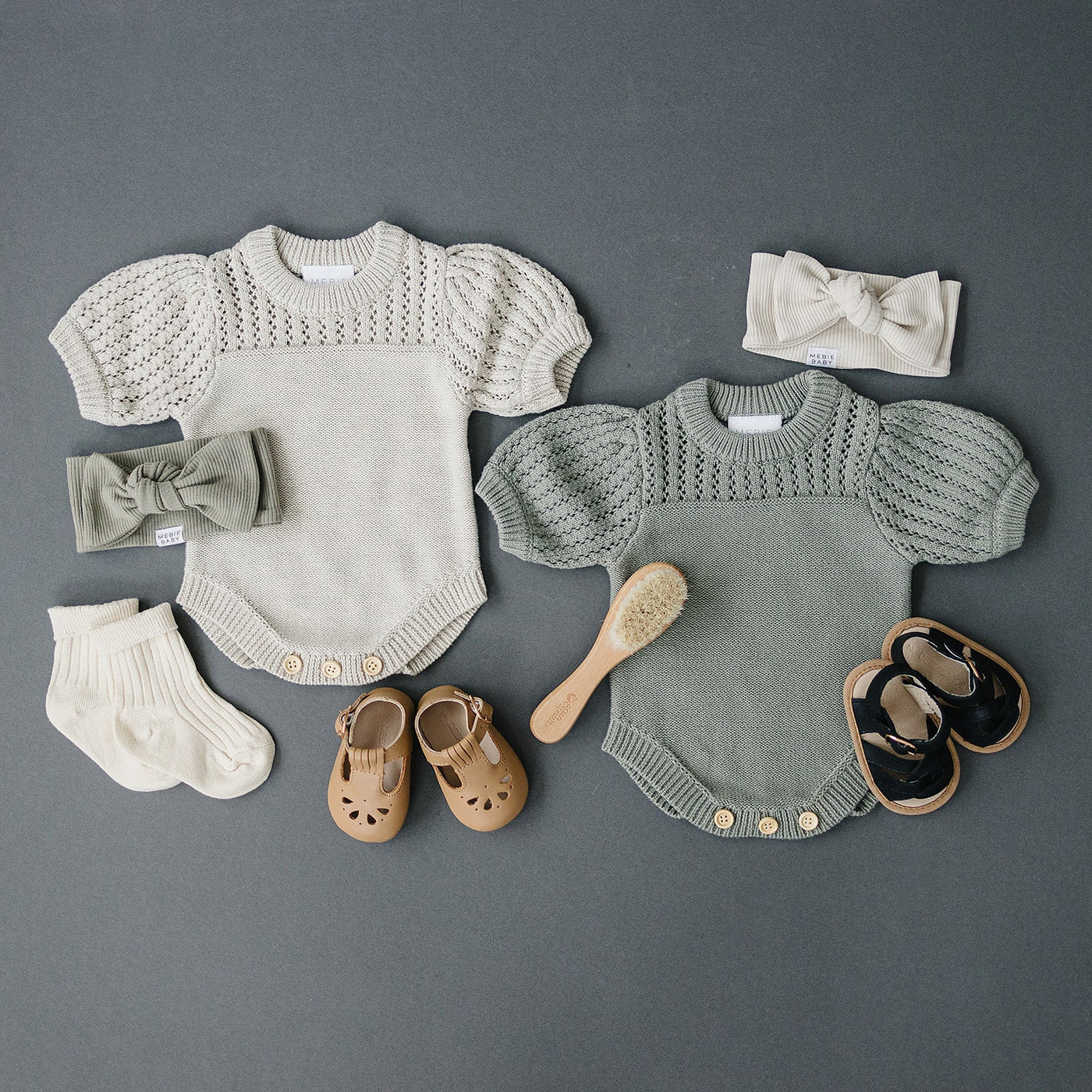 a group of baby clothes and shoes