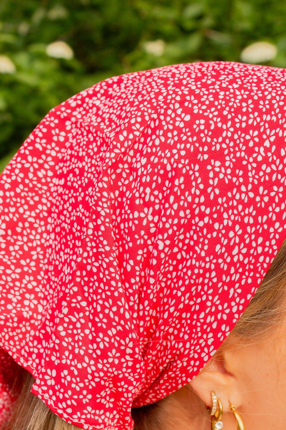a woman wearing a red bandana