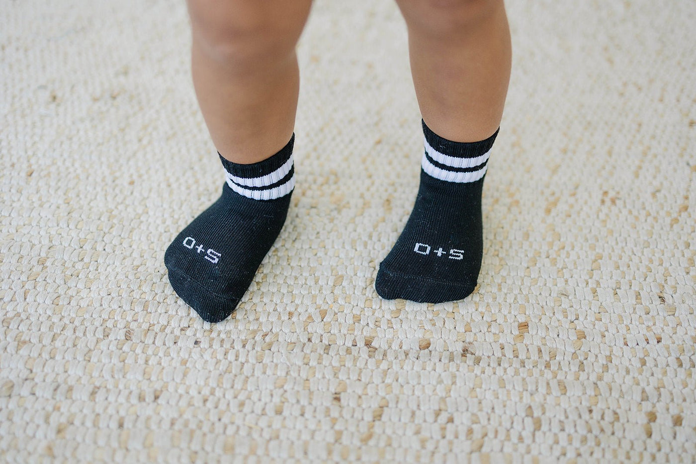 a child's feet with socks