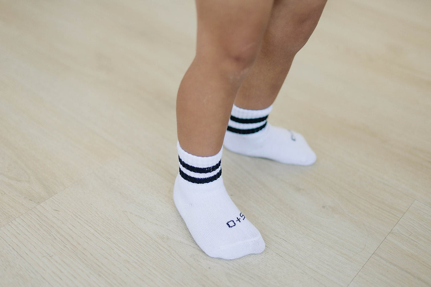 a person's legs and feet in socks