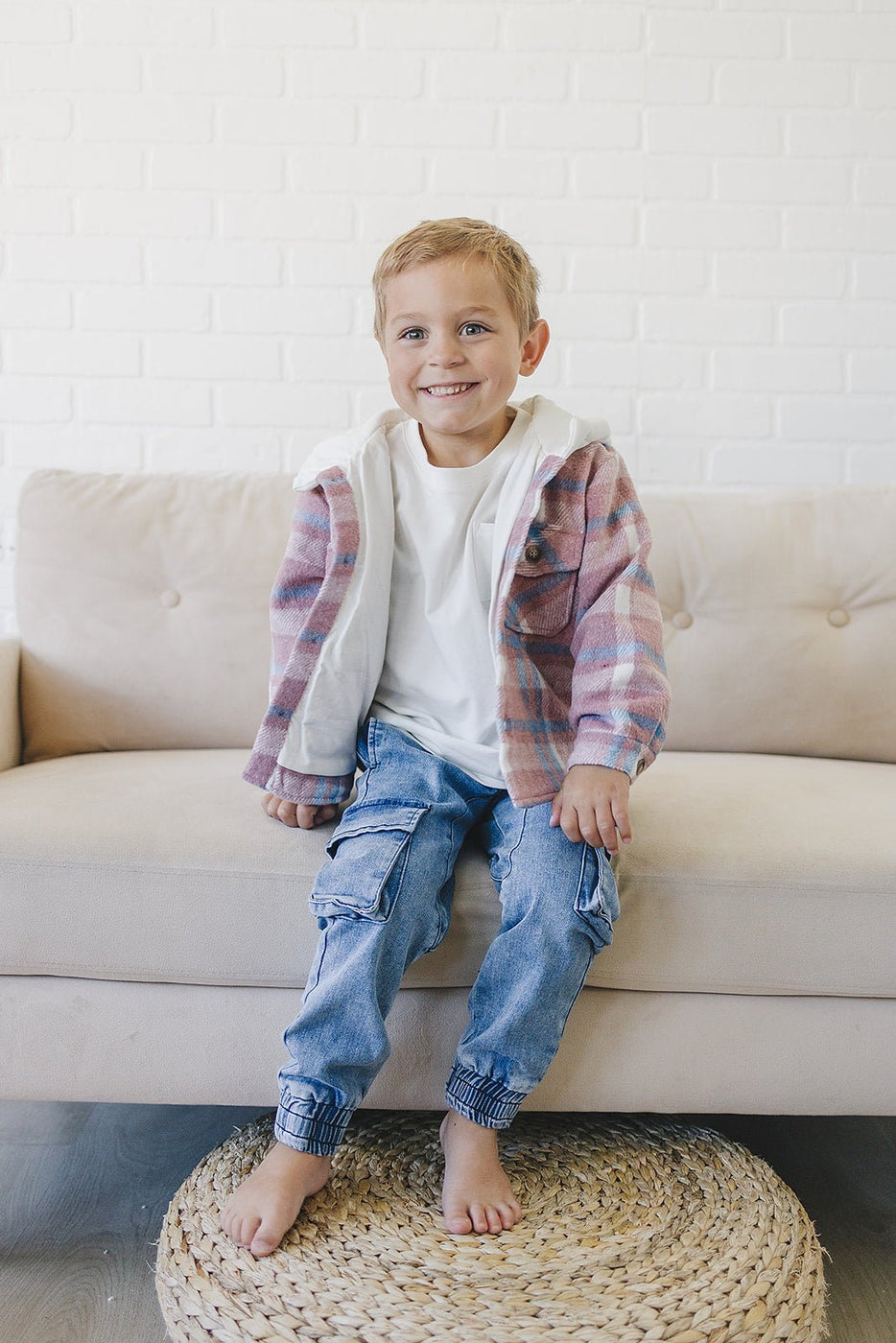 a boy sitting on a couch