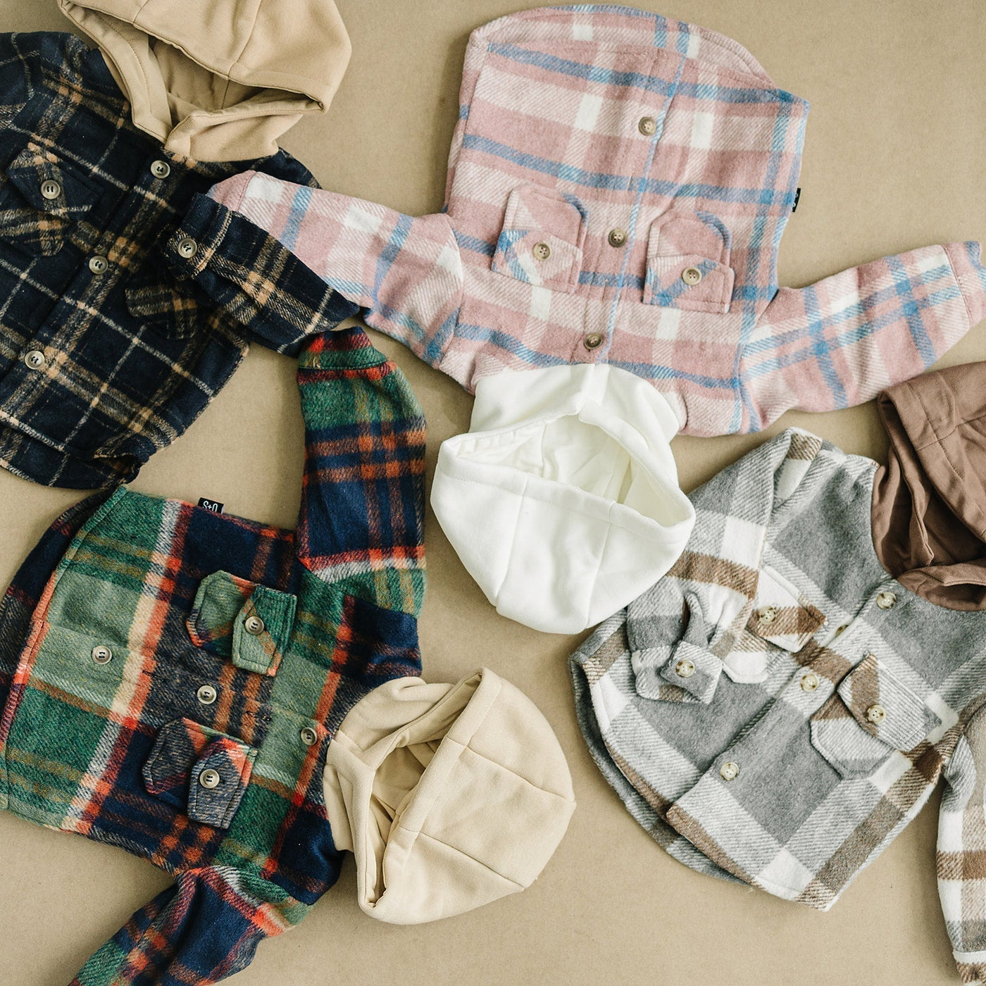 a group of baby clothes