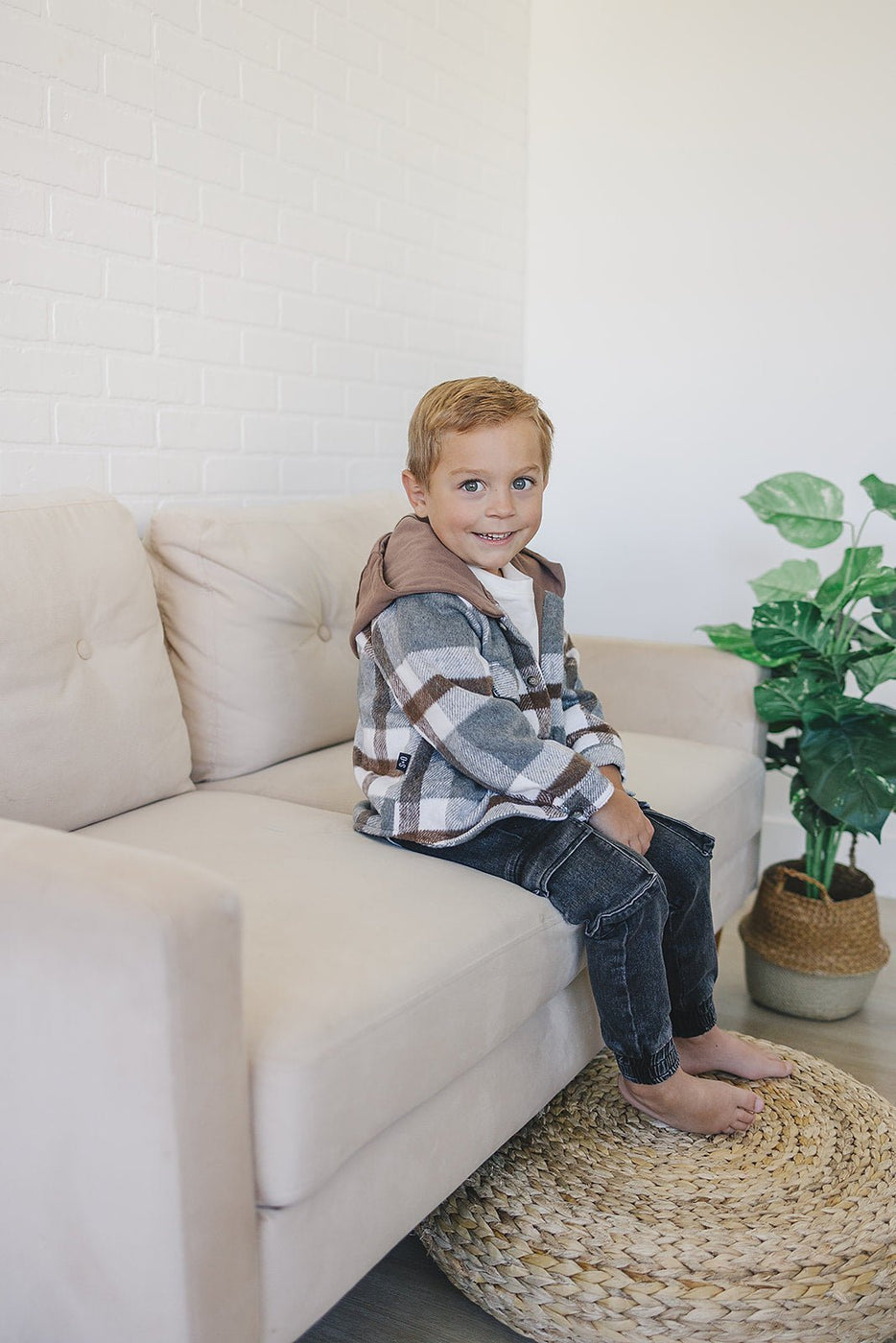 a boy sitting on a couch