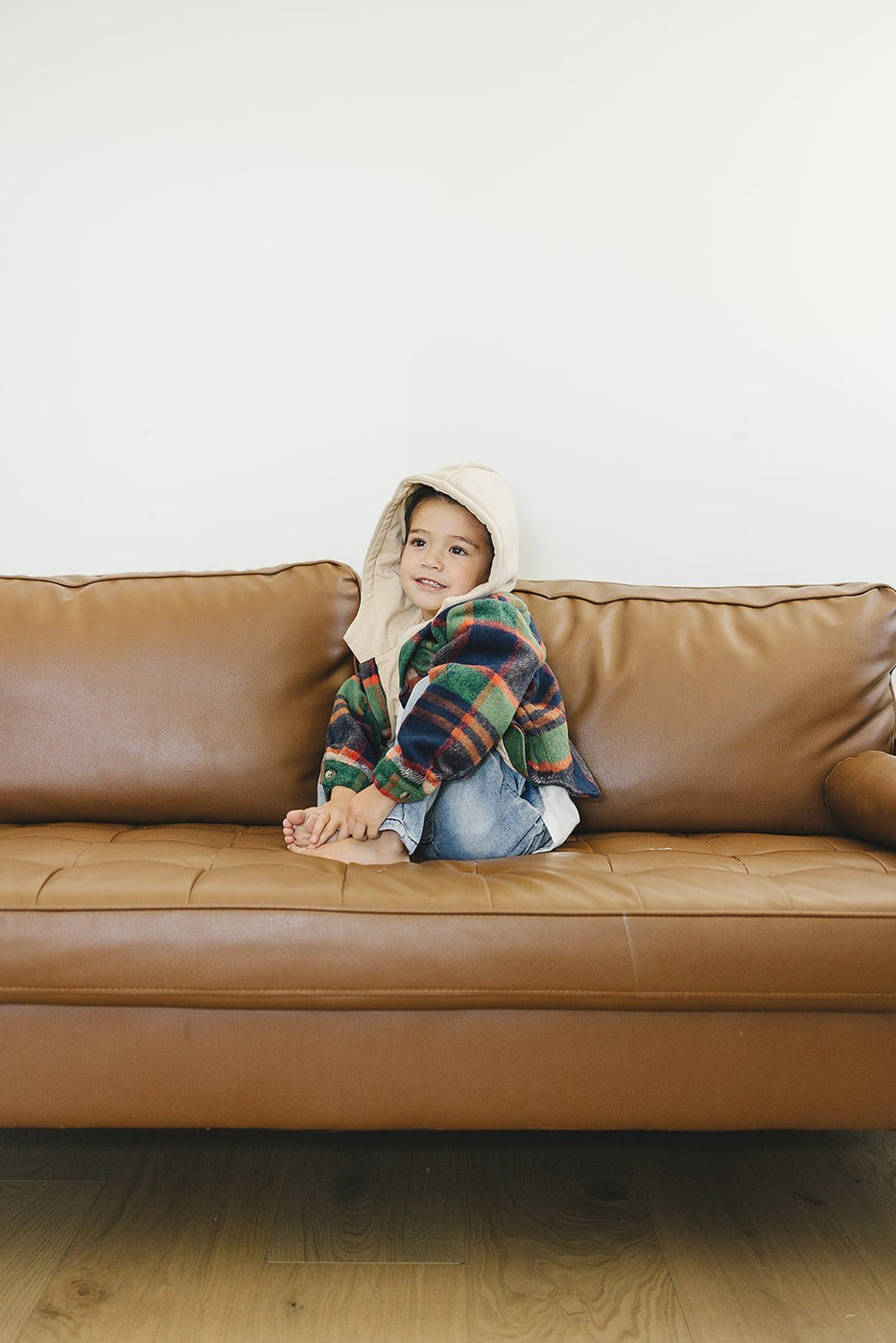 a child sitting on a couch