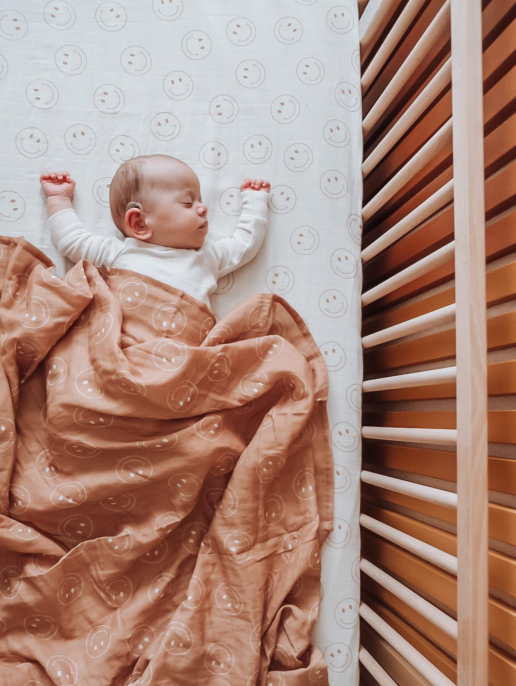 a baby sleeping in a crib