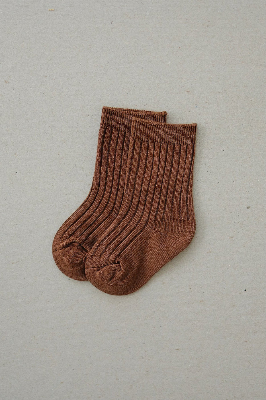 a pair of brown socks