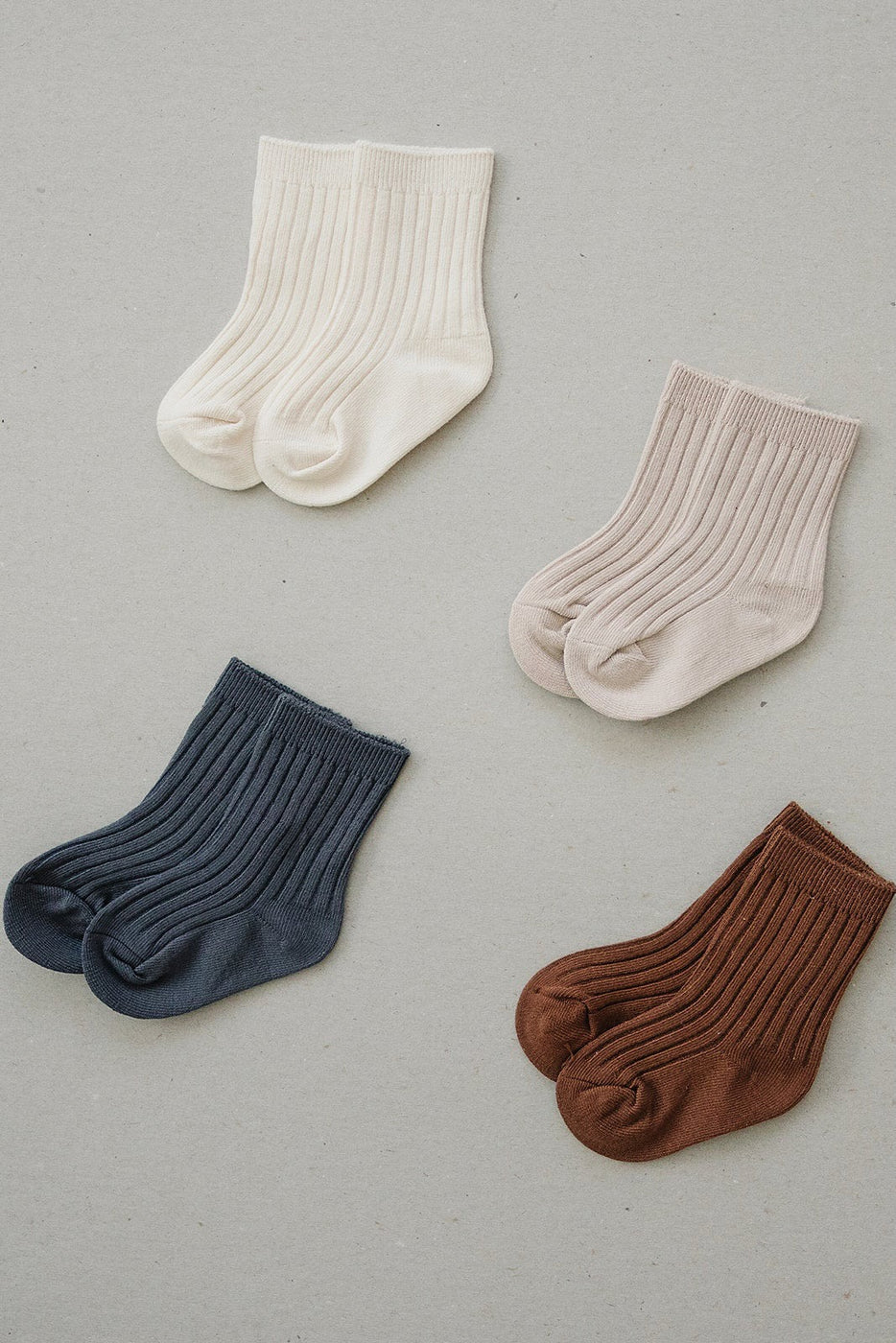 a group of socks on a white surface