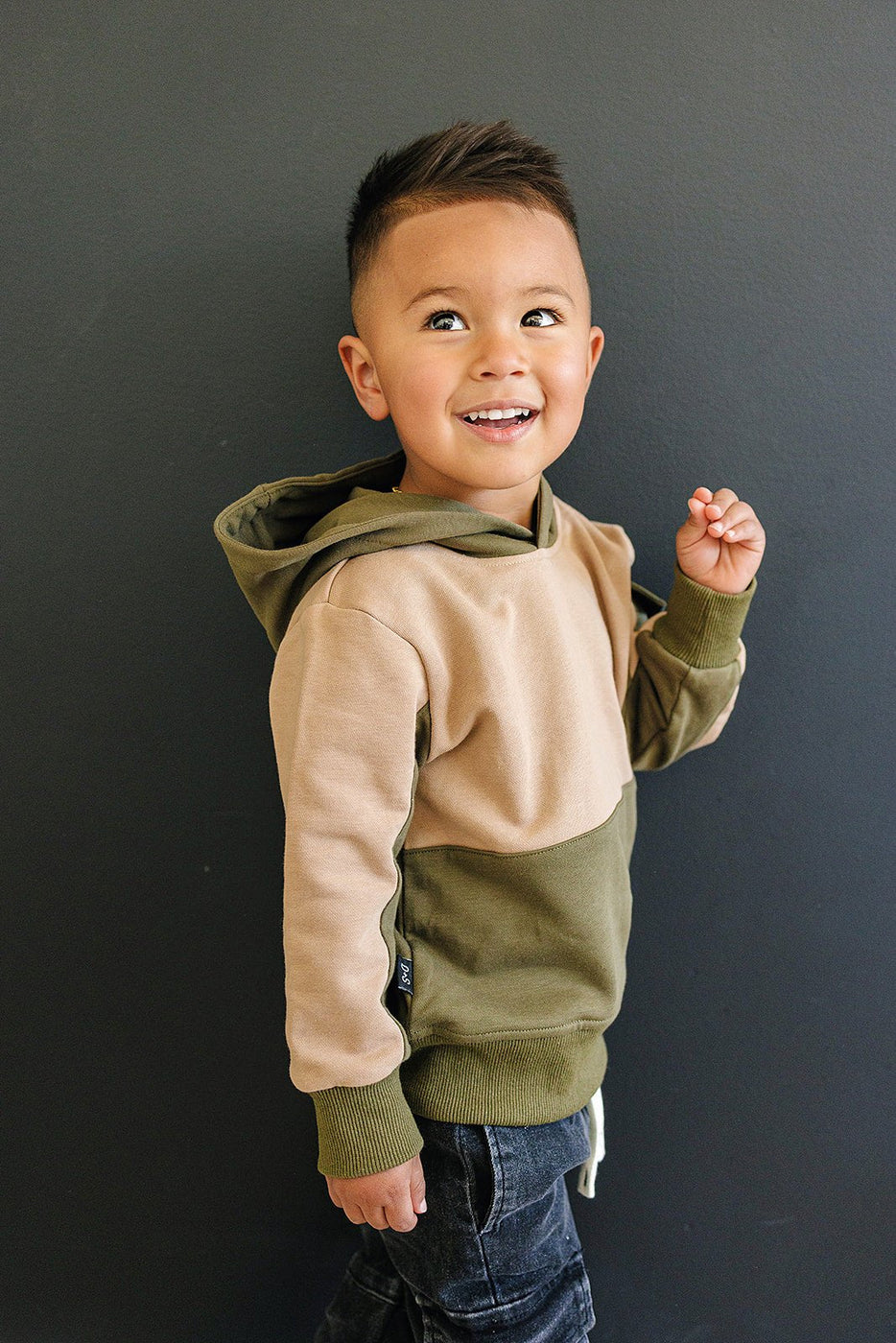 a child smiling and looking up