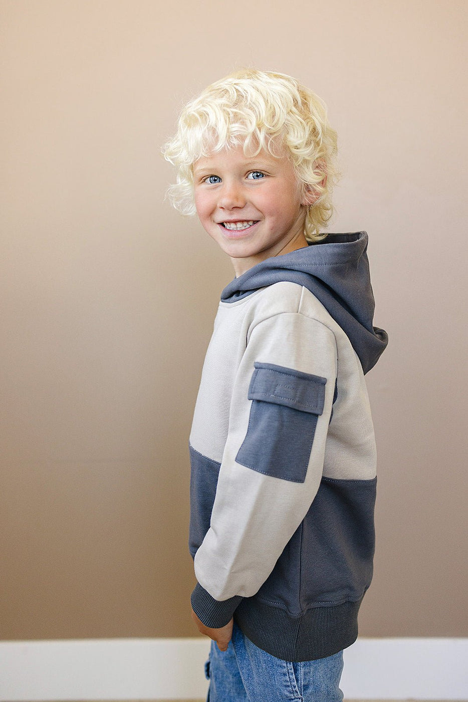 a boy with blonde hair smiling