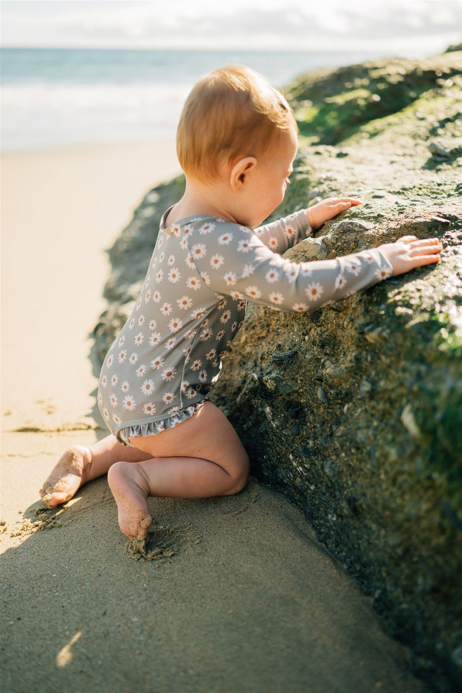 a baby on a beach
