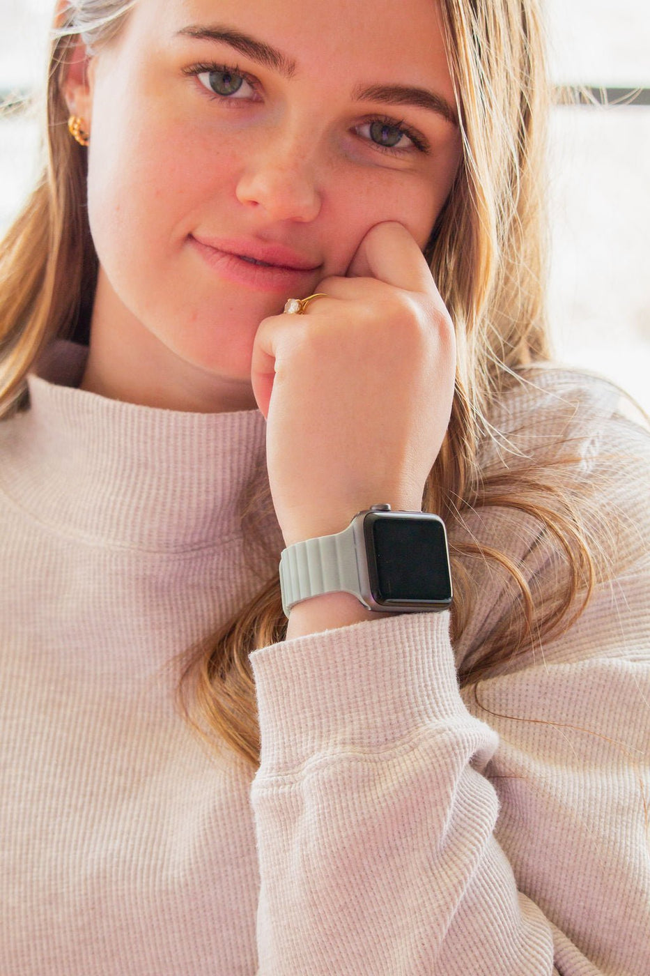 a woman with a smart watch