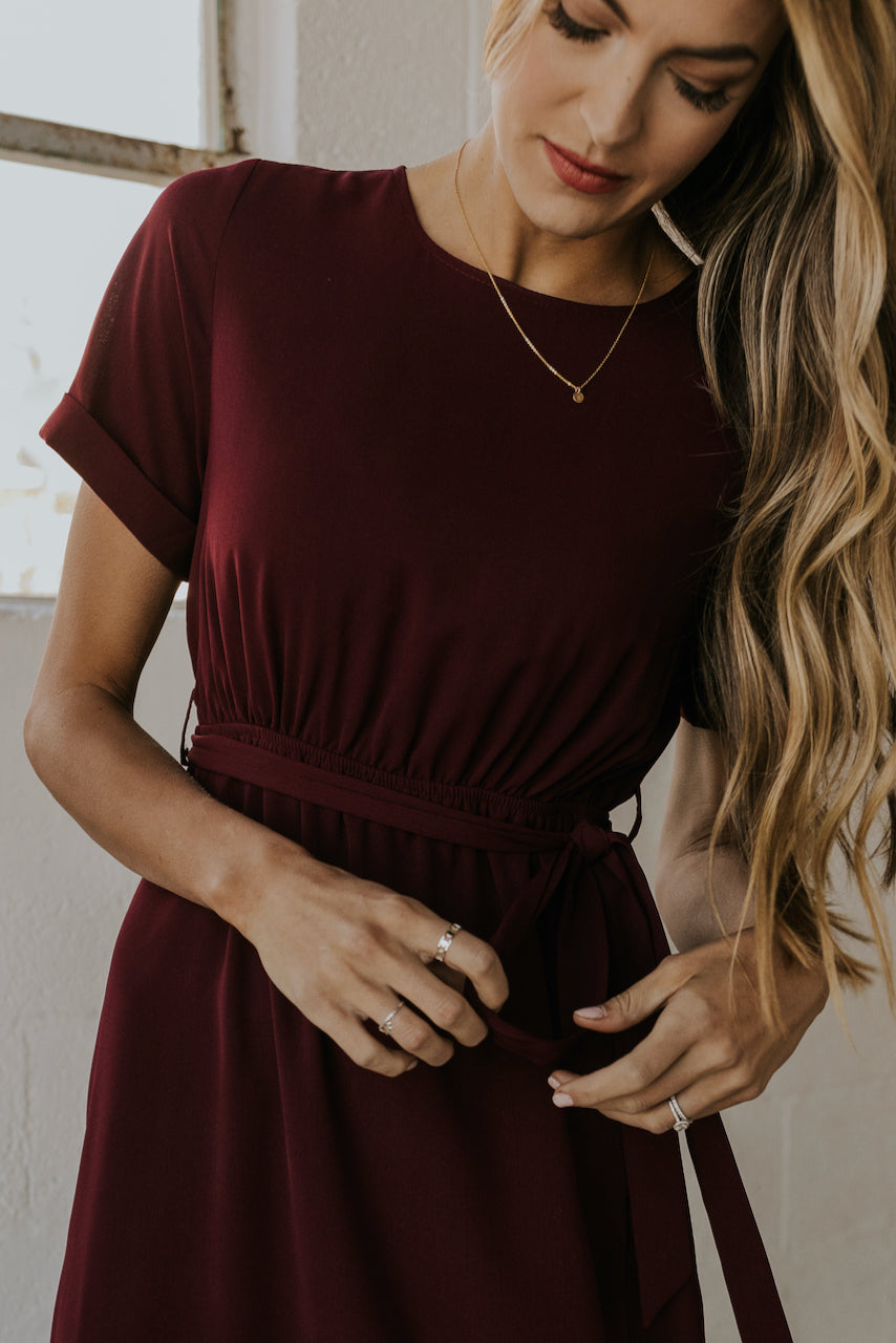 a woman wearing a red dress